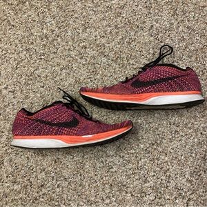 nike flyknit racer size 11 men’s pink/orange/red fusion running track sneaker